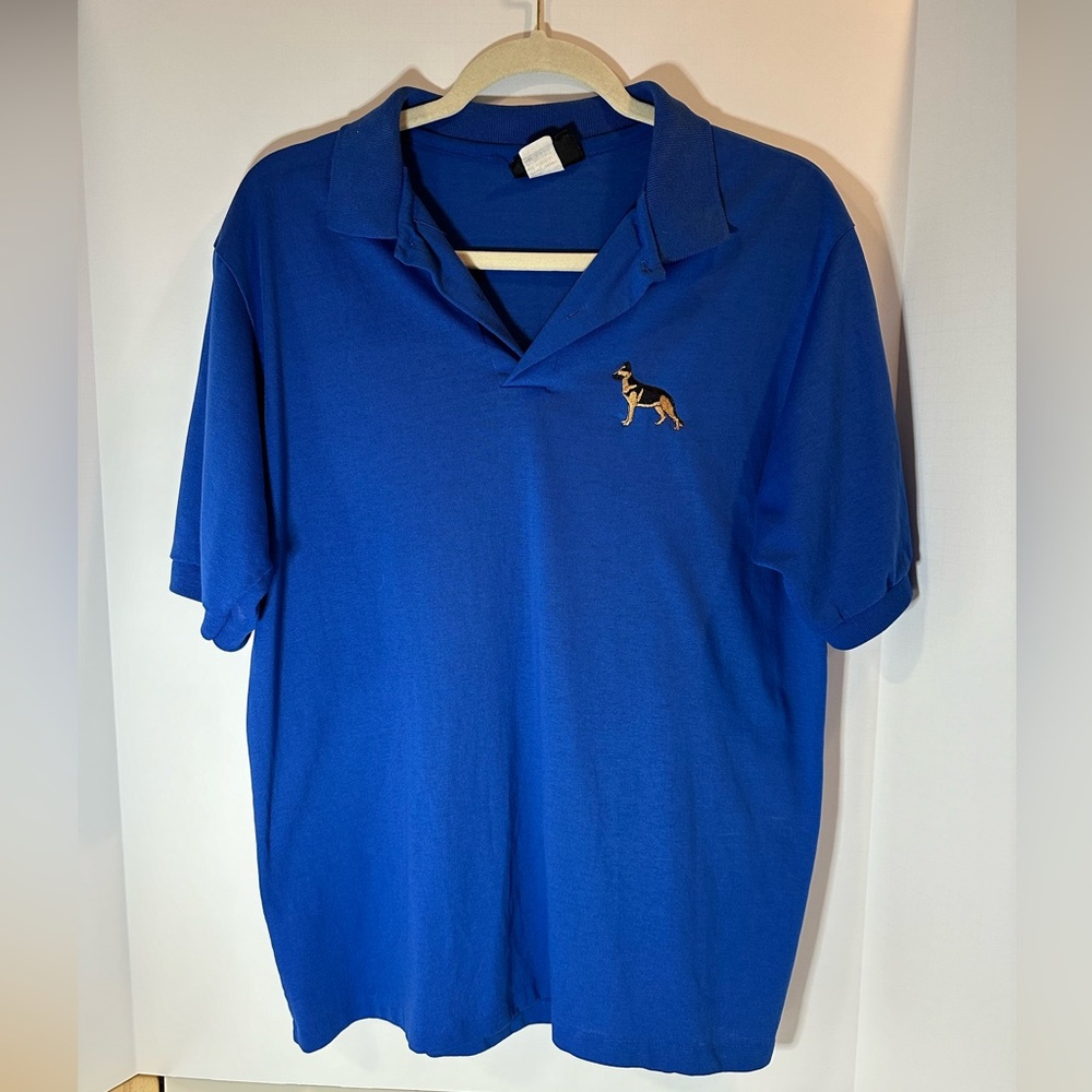 German Shepherd polo shirt royal blue, 50/50 cotton poly. Knits brand.